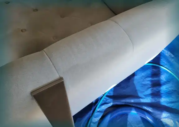 Upholstery cleaning arm of a sofa
